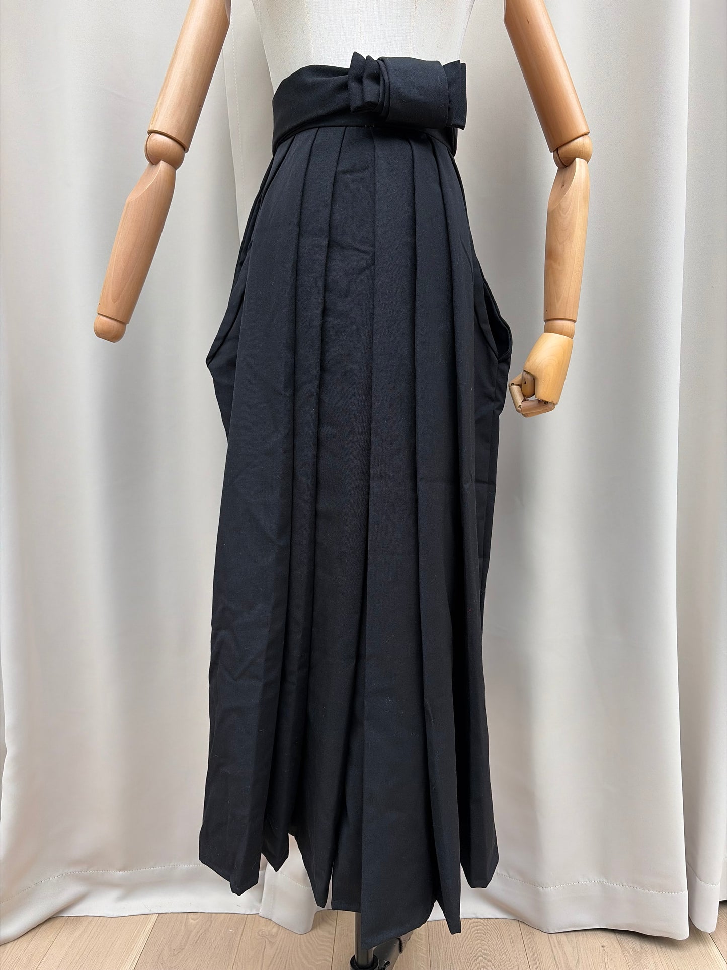 Black pleated Japanese hakama laid flat