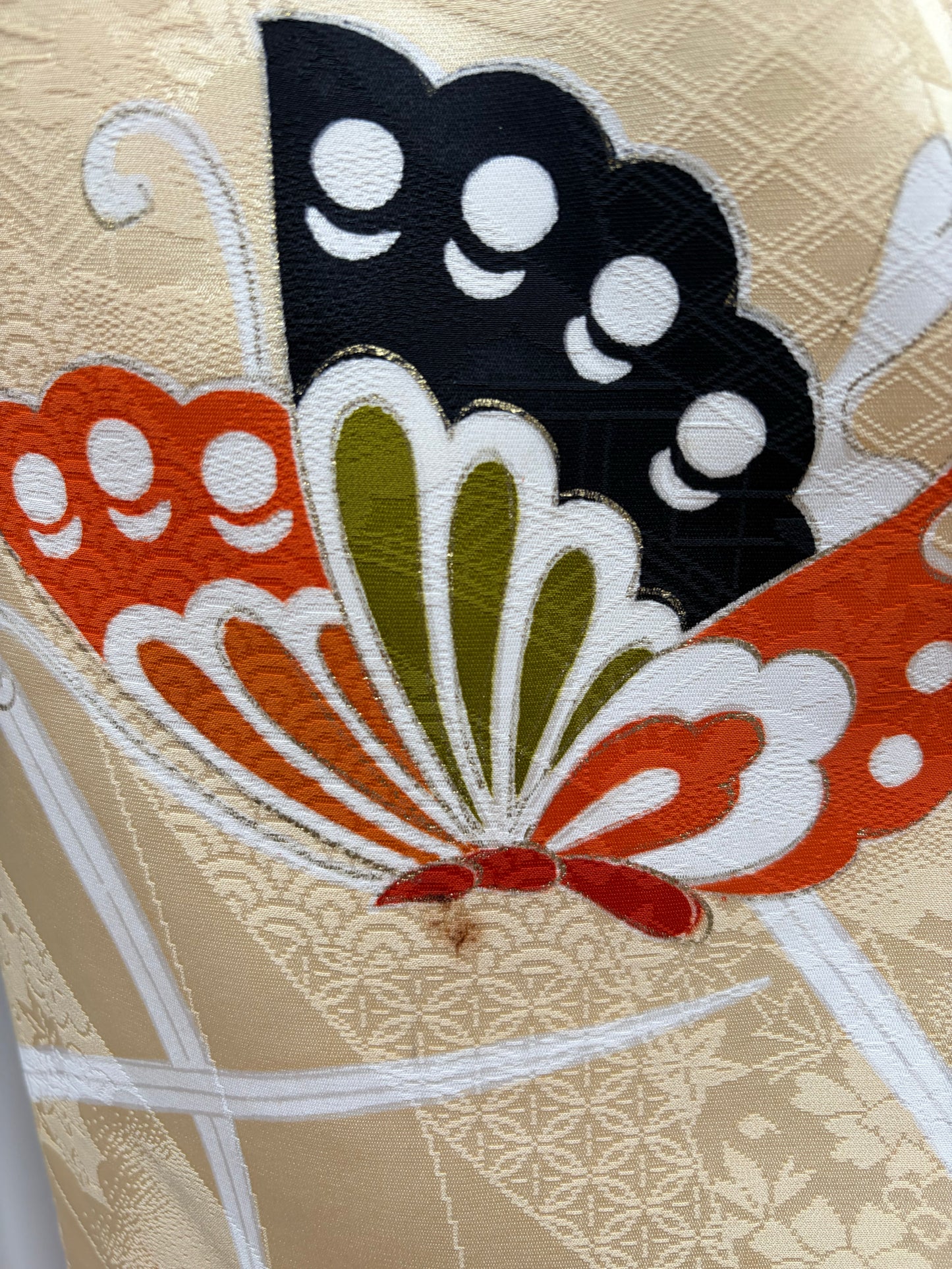 Butterfly and gold-thread embroidery detail on the furisode