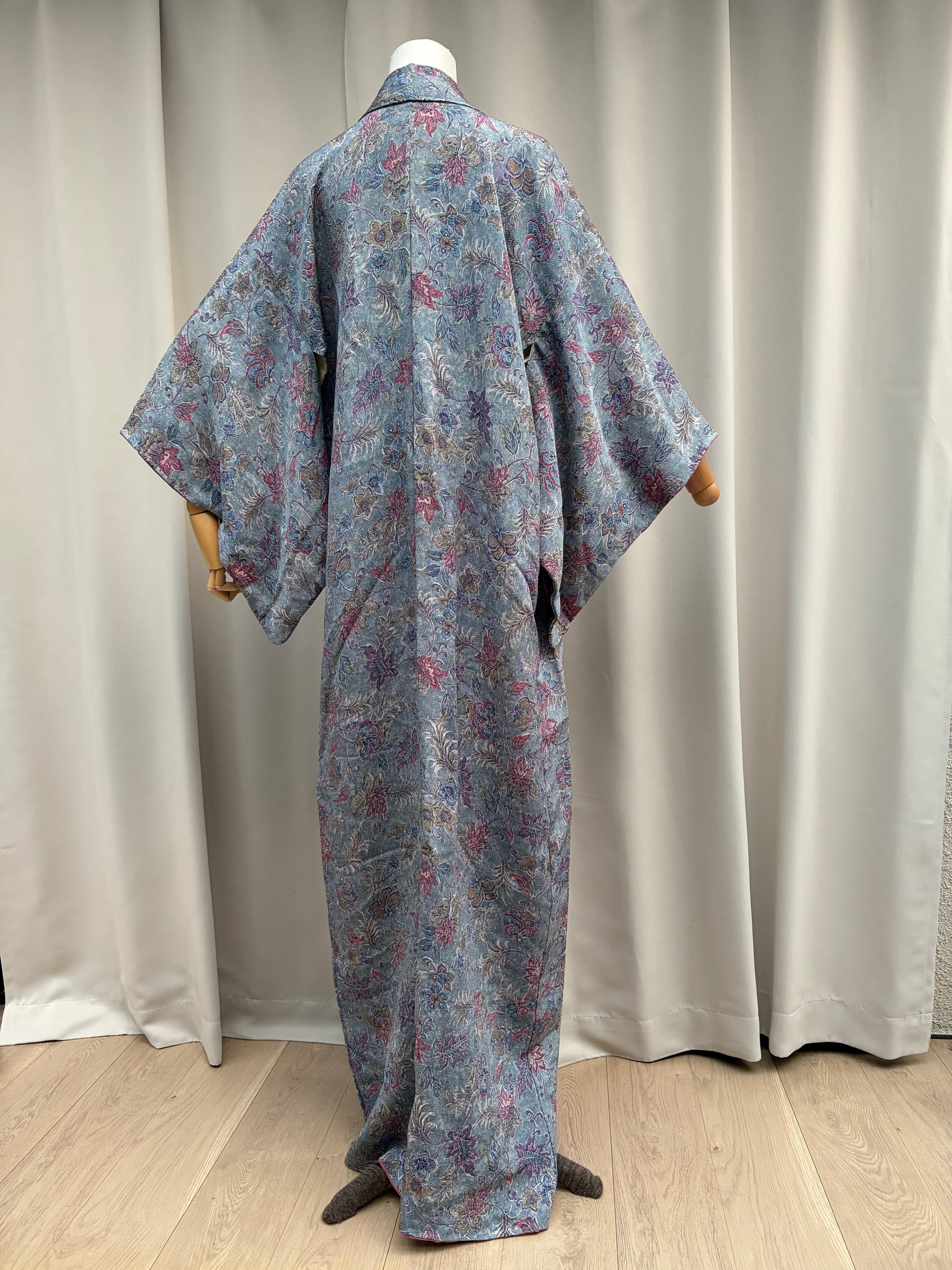 Vintage dusty blue floral kimono displayed open on a mannequin