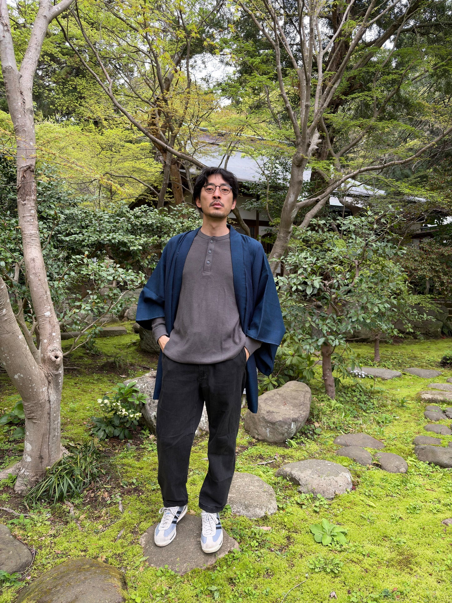 Man wearing the navy Japanese men's haori as an open jacket