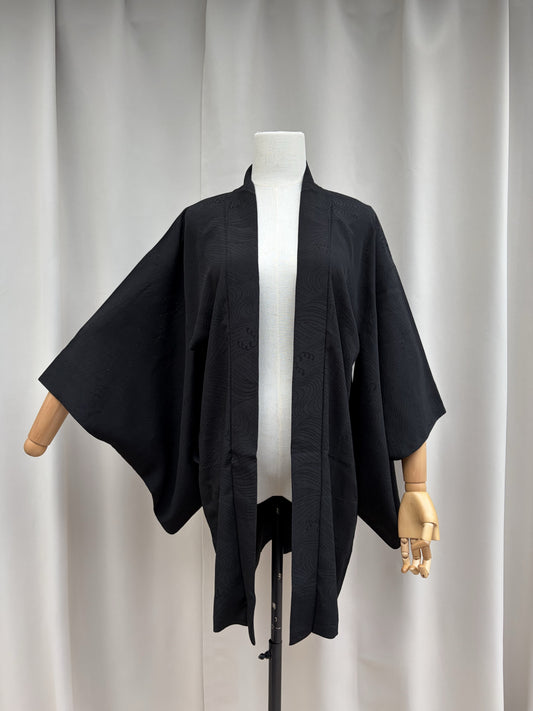 Front view of the black sheer summer haori on a mannequin