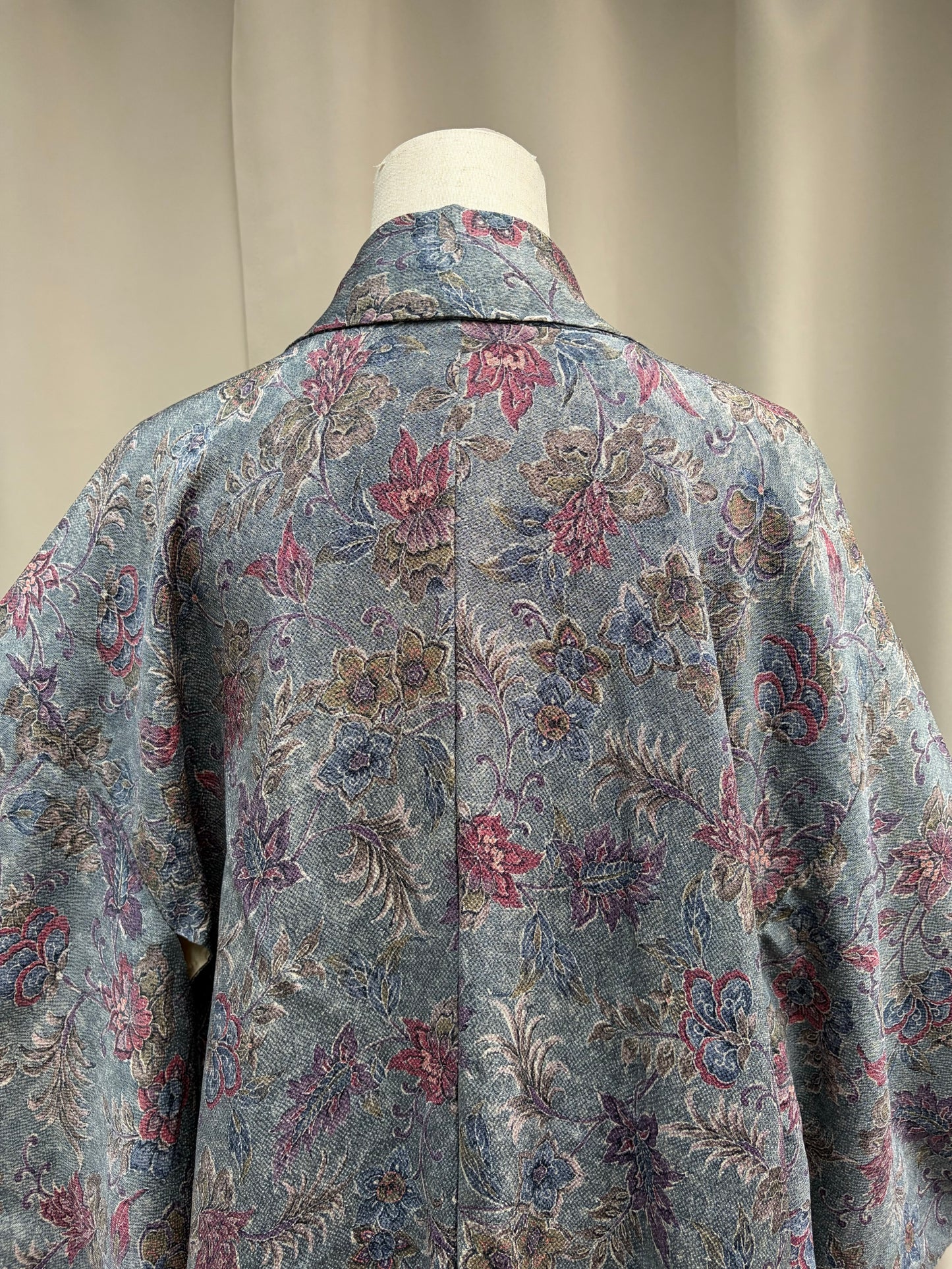 Draped detail showing the textured floral jacquard fabric