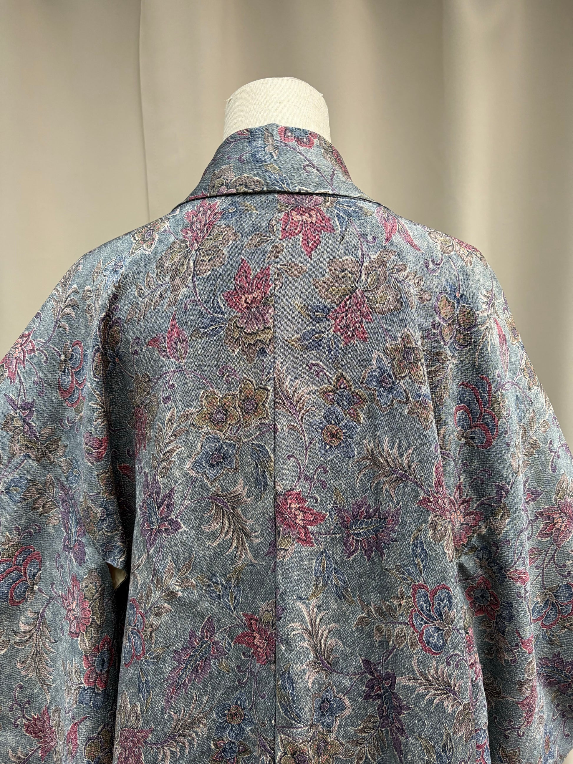 Draped detail showing the textured floral jacquard fabric