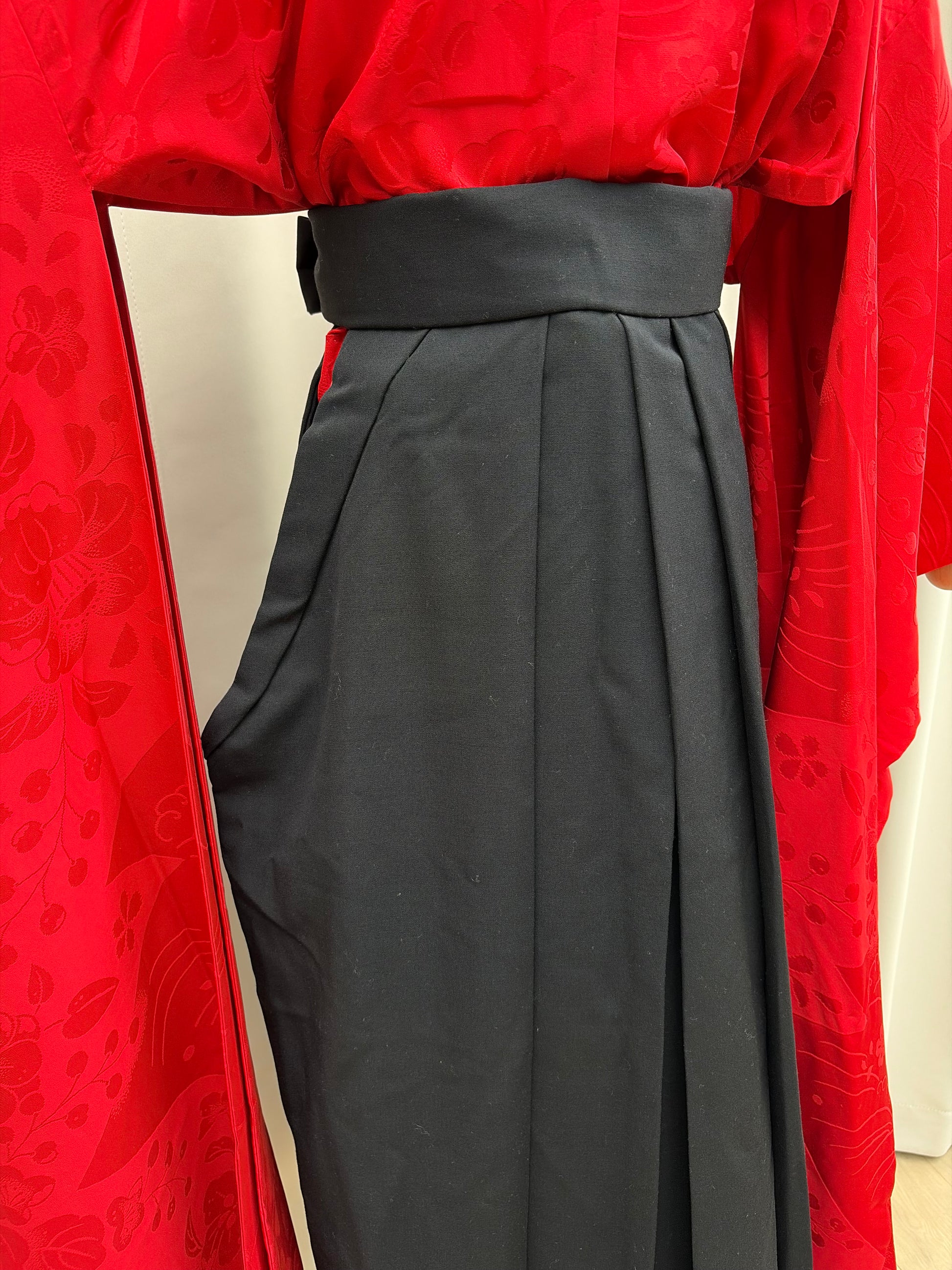 Close-up of the crisp pleats and waist of the hakama