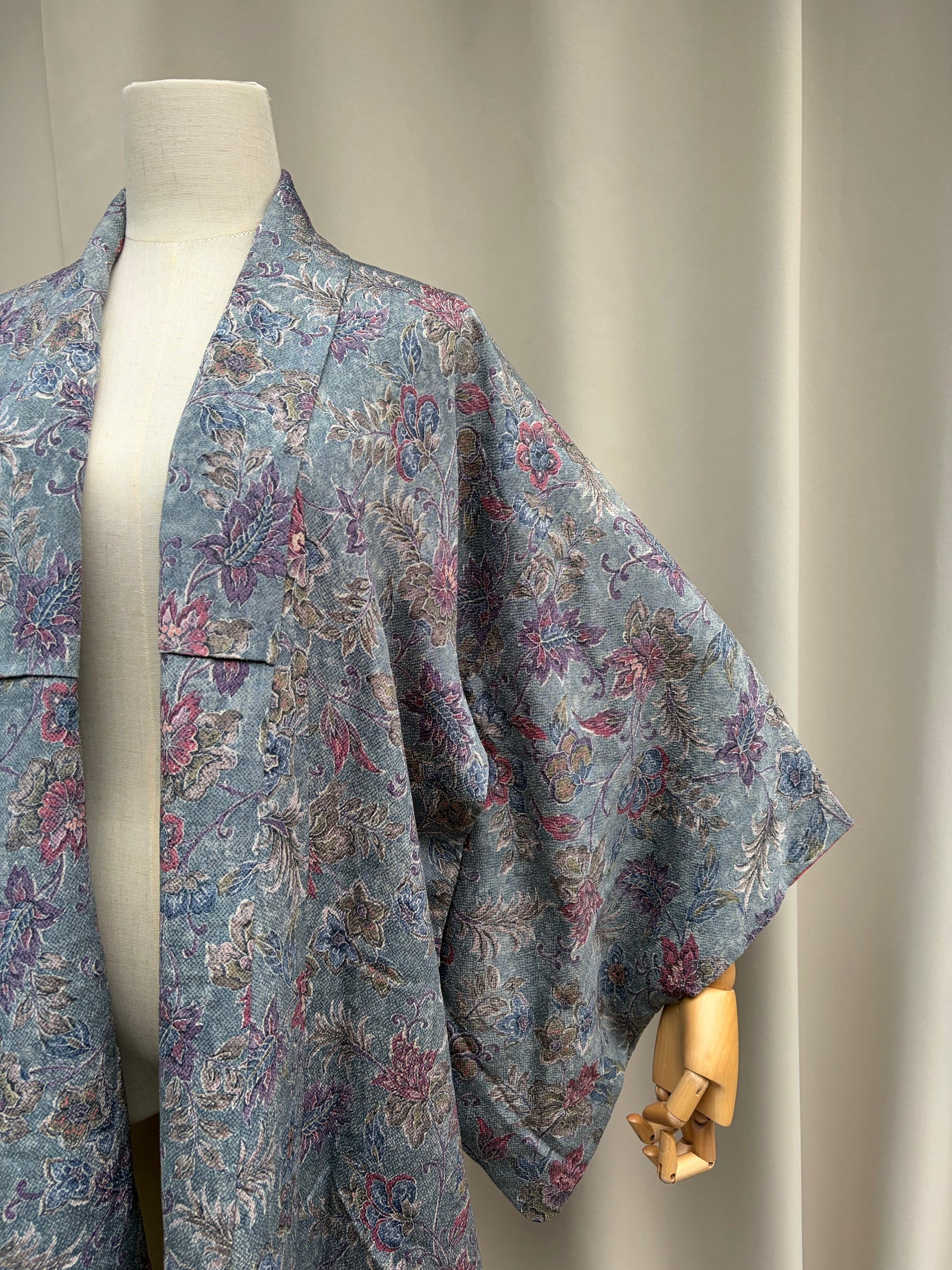 Close-up of the multicolour floral pattern in pink, mauve and blue