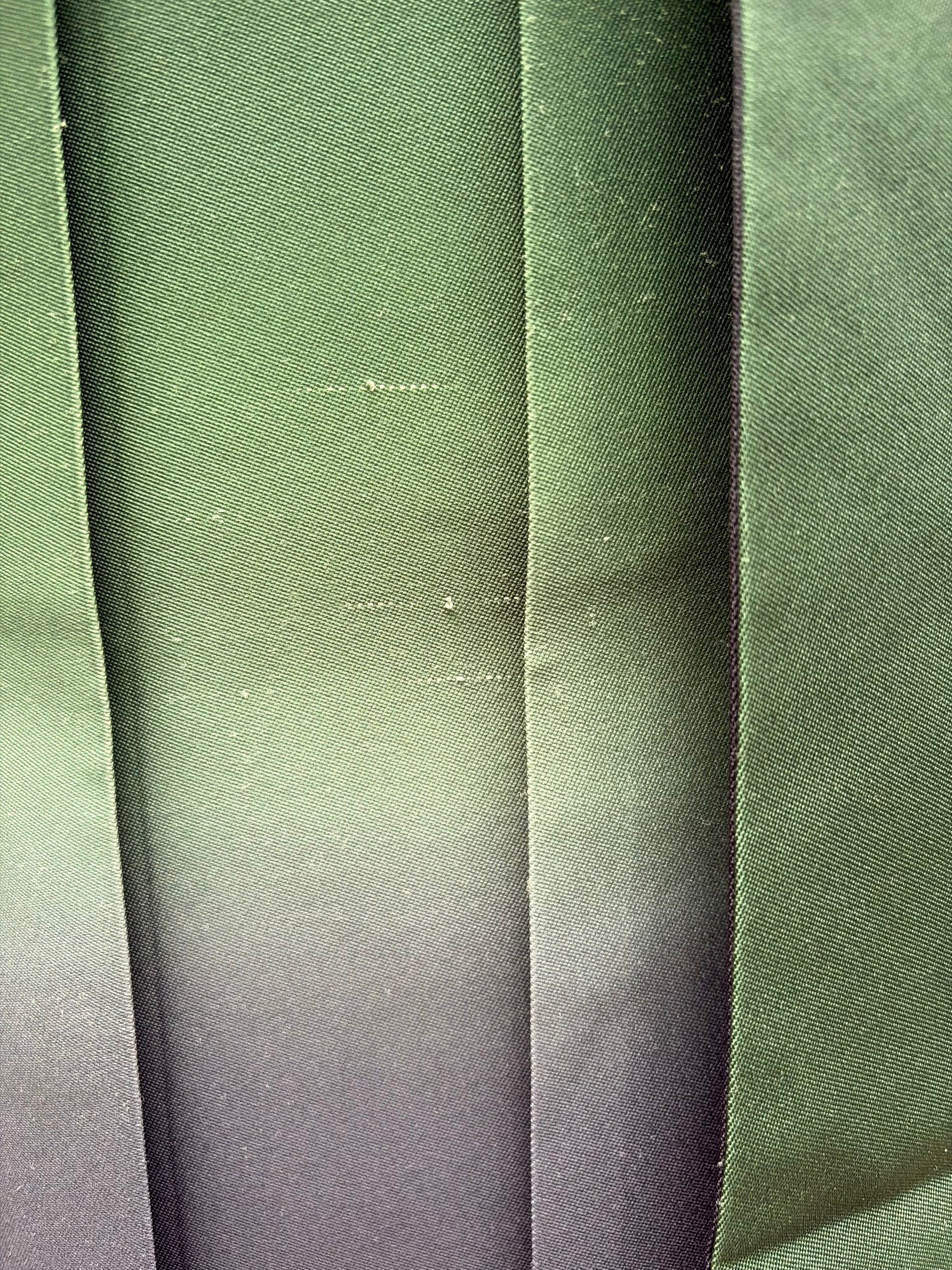 Close-up of the navy and green ombre fabric