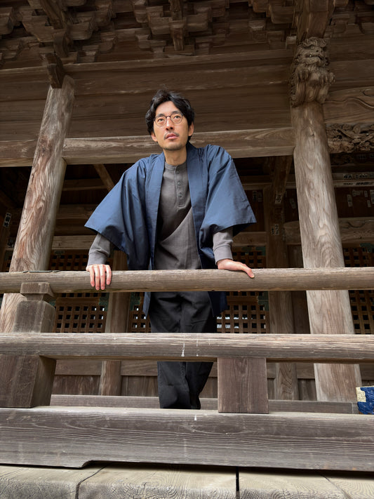 Model in the navy men's haori, side view