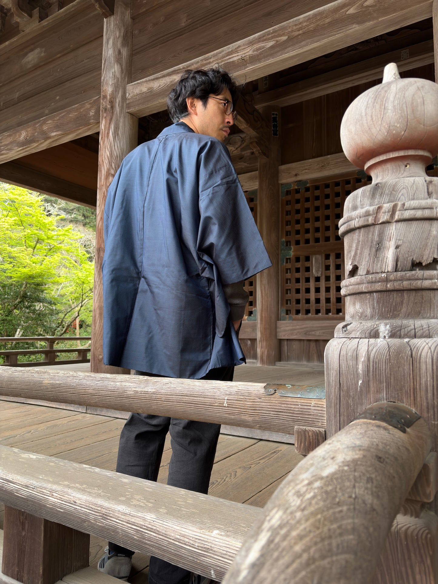 Vintage navy men's haori worn open, showing the dragon-and-waves reverse