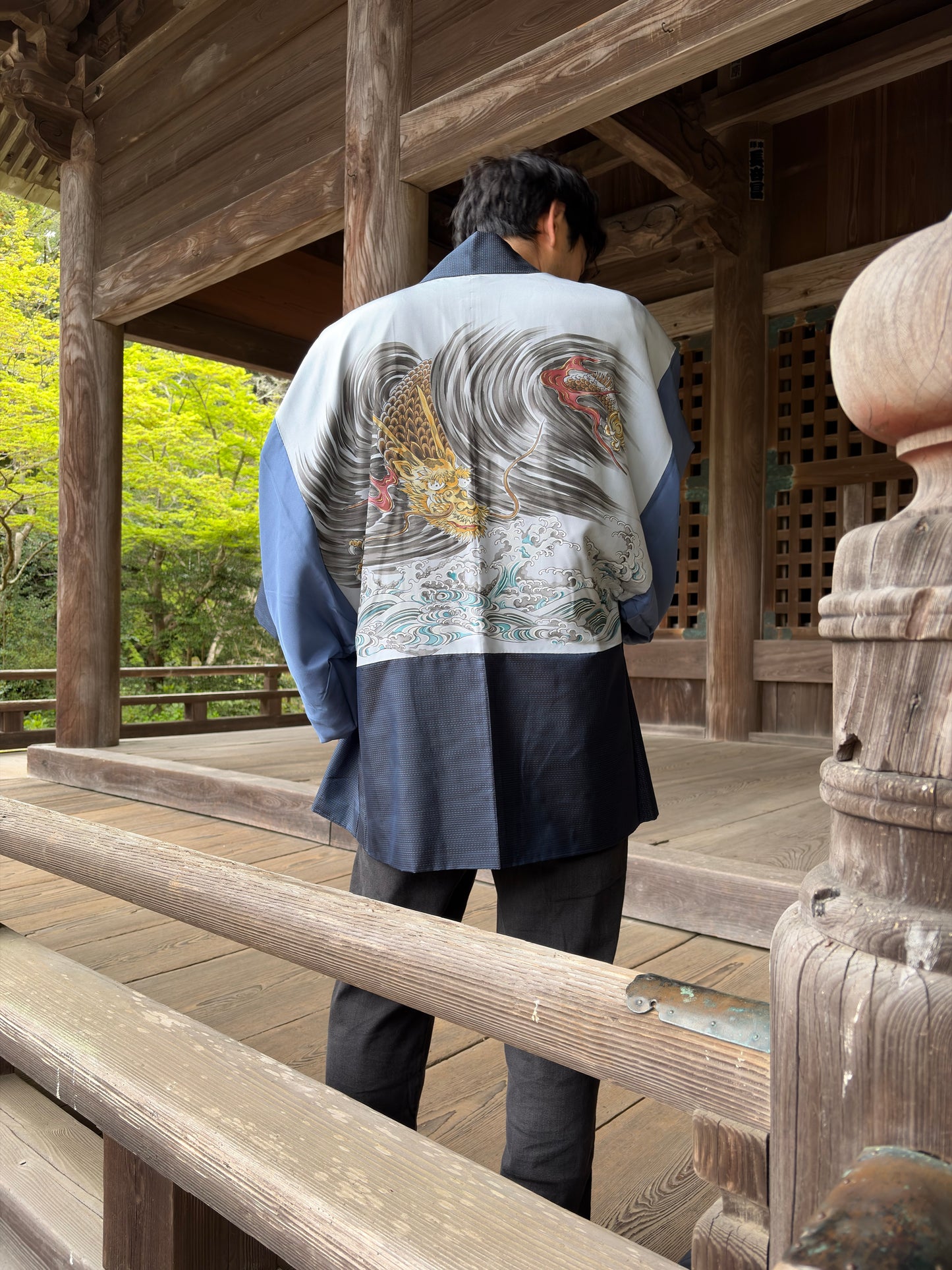 Vintage navy men's haori worn open, showing the dragon-and-waves reverse