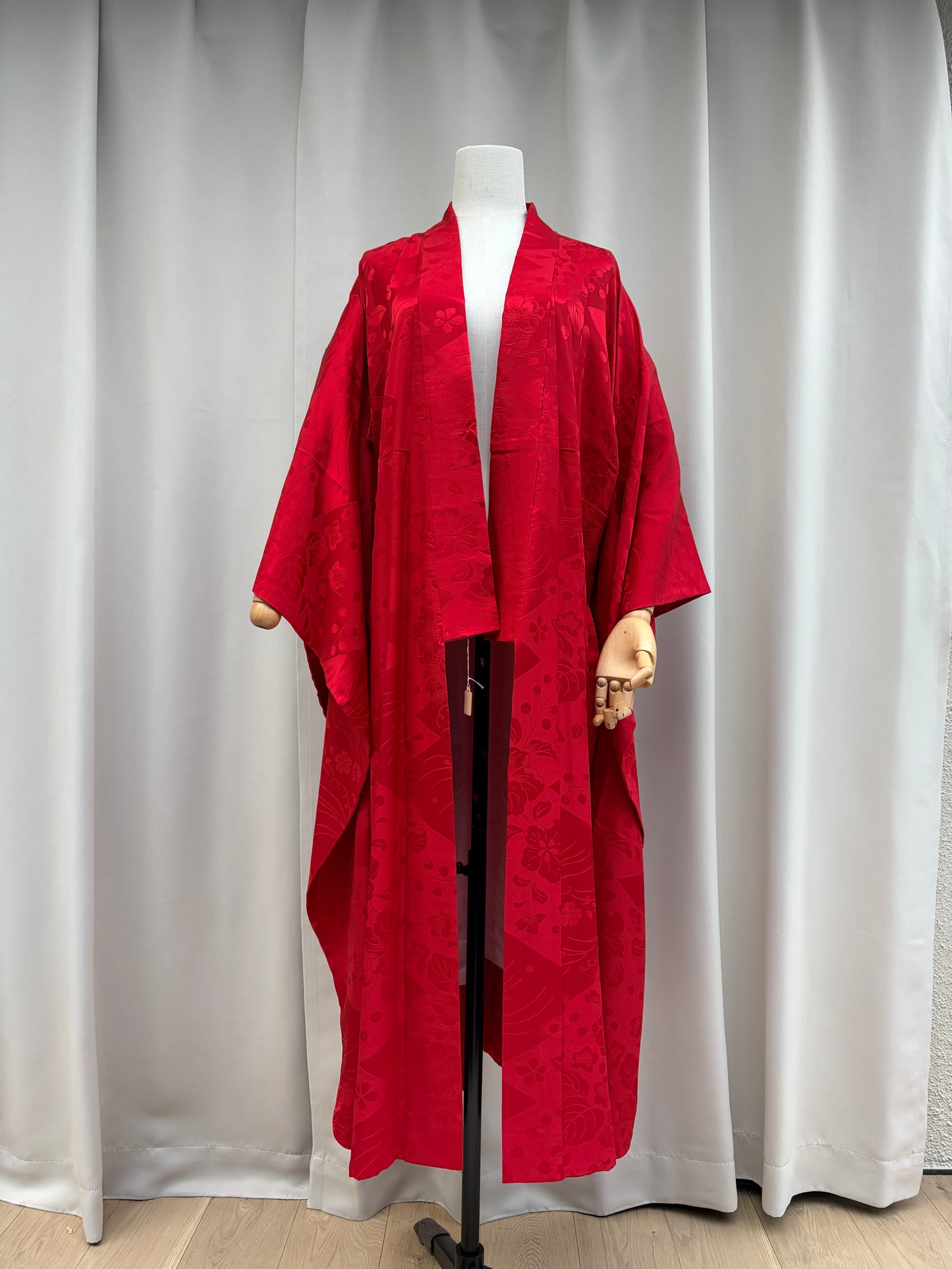 Vintage red long-sleeved nagajuban shown full length, woven tone-on-tone floral pattern