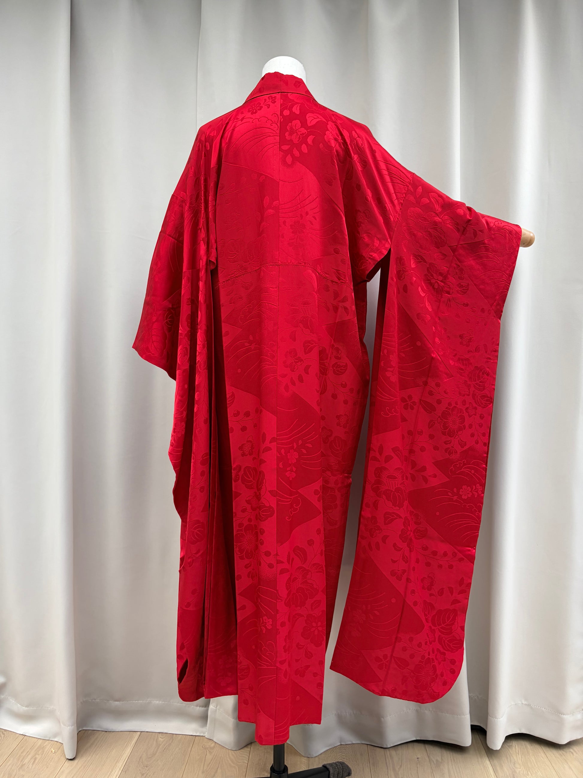 Vintage red nagajuban shown open to reveal the lining