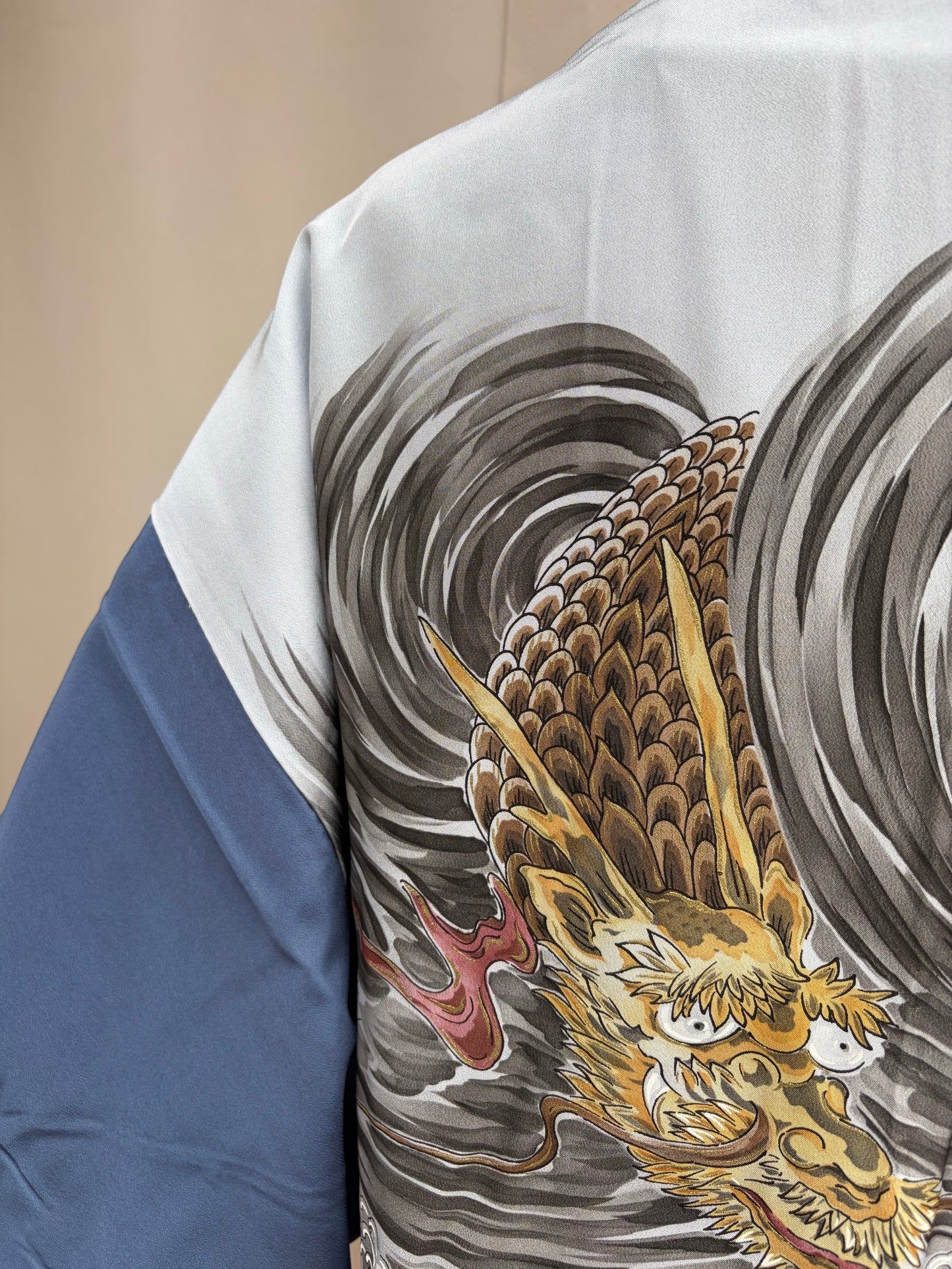 Reverse of the navy men's haori: hand-painted golden dragon among grey and blue waves