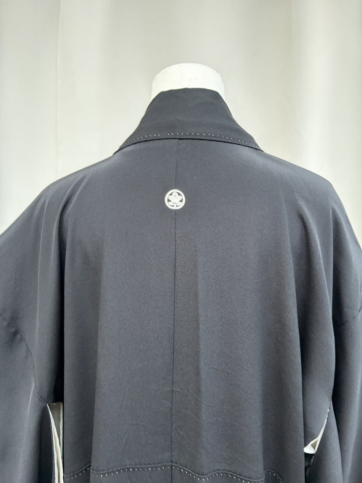 Family crest at the centre back of the black kimono