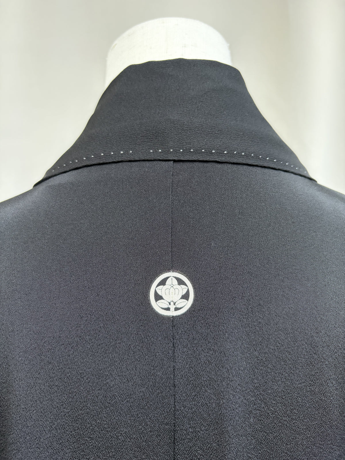 Crest at the collar of the formal kimono