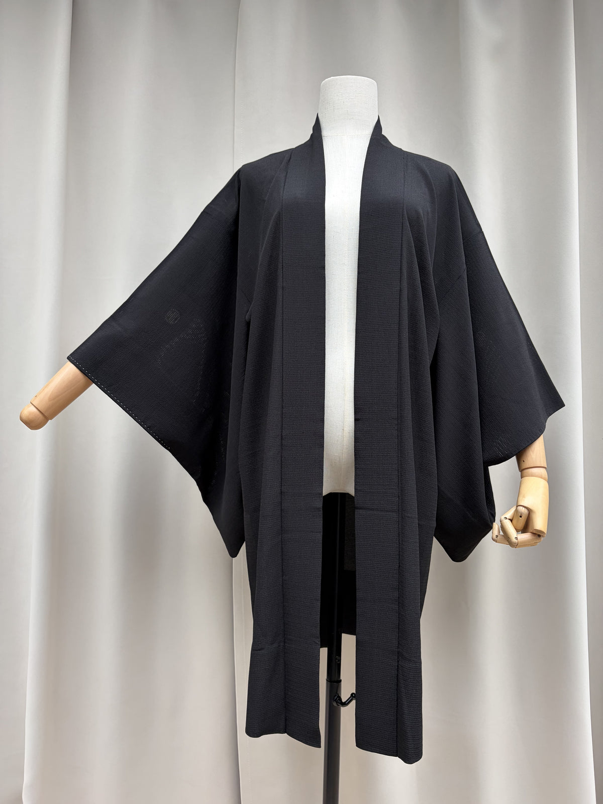 Long black vintage haori seen from the front on a mannequin
