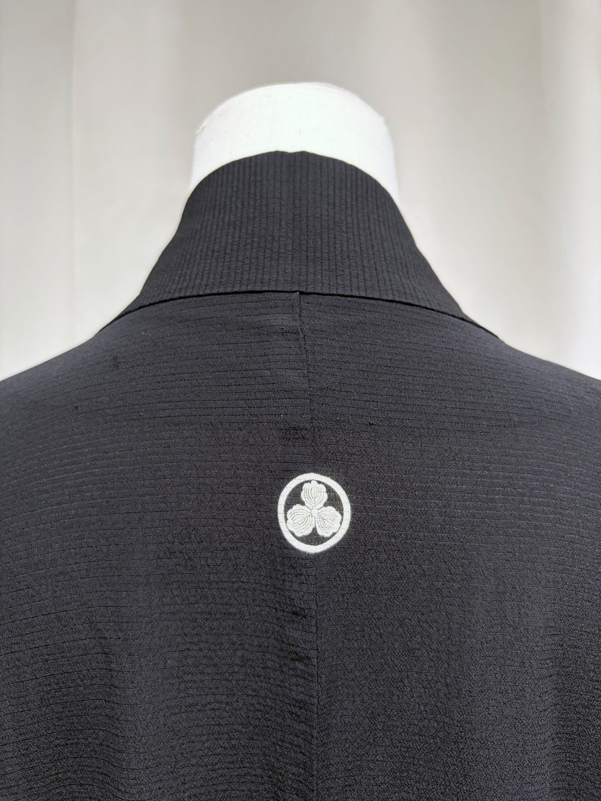 Family crest at the centre back of the black haori