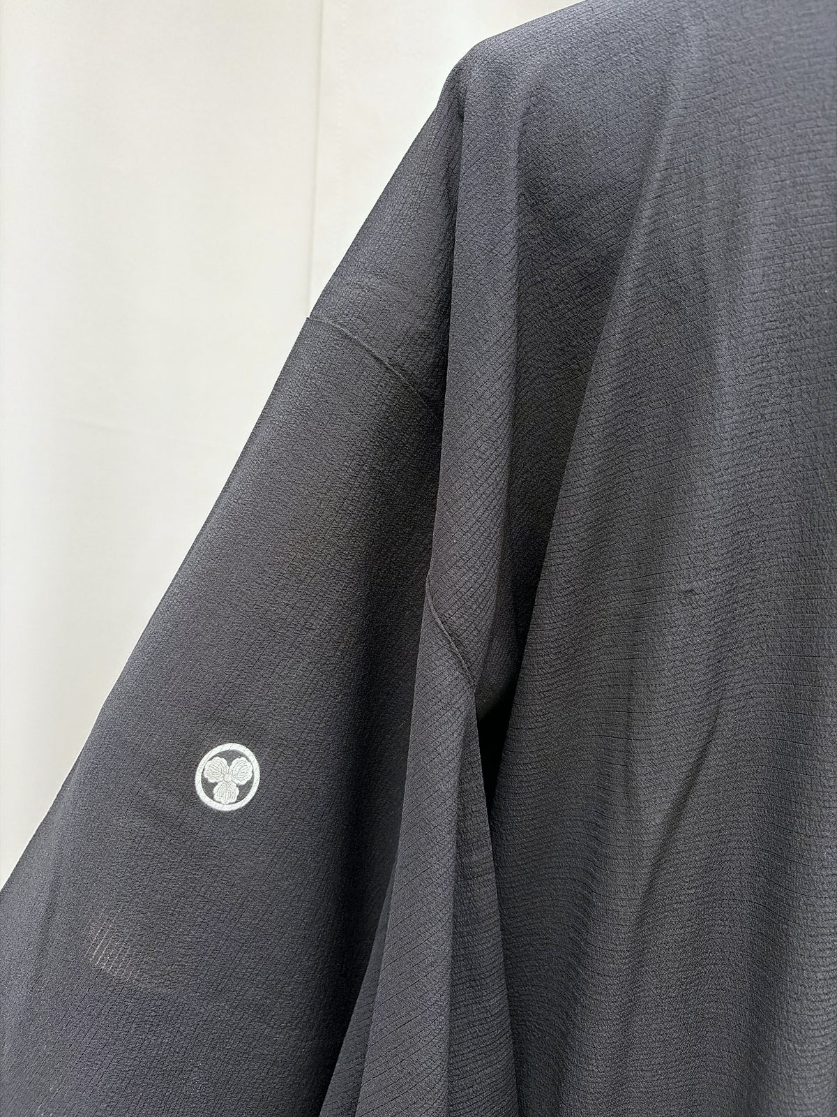 Family crest on the sleeve of the black vintage haori