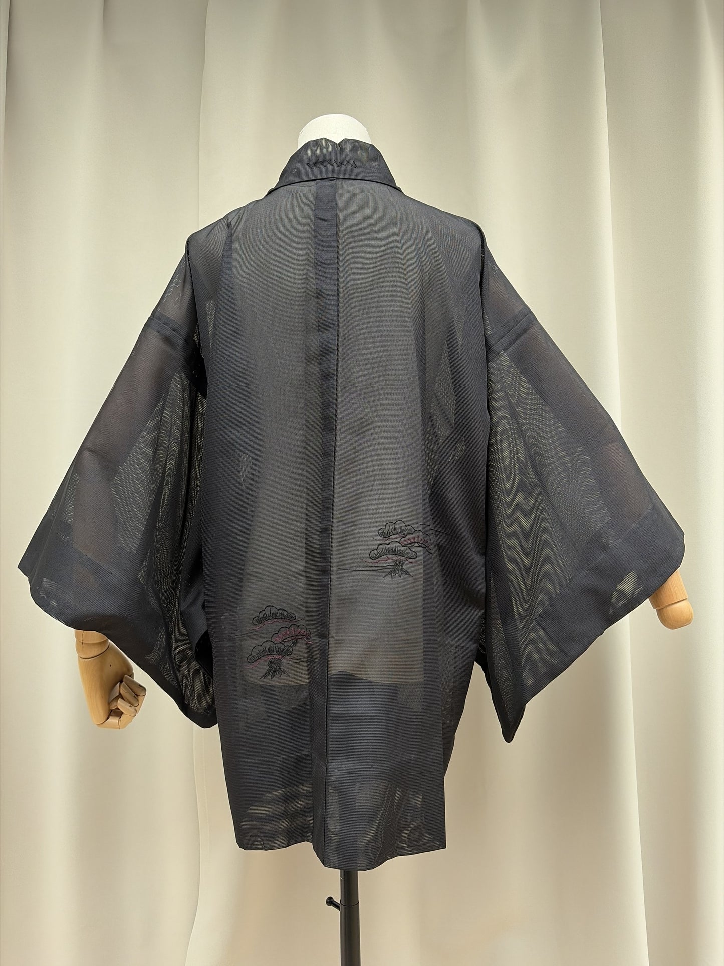 Back of the sheer black haori with embroidered foliage in black and pink