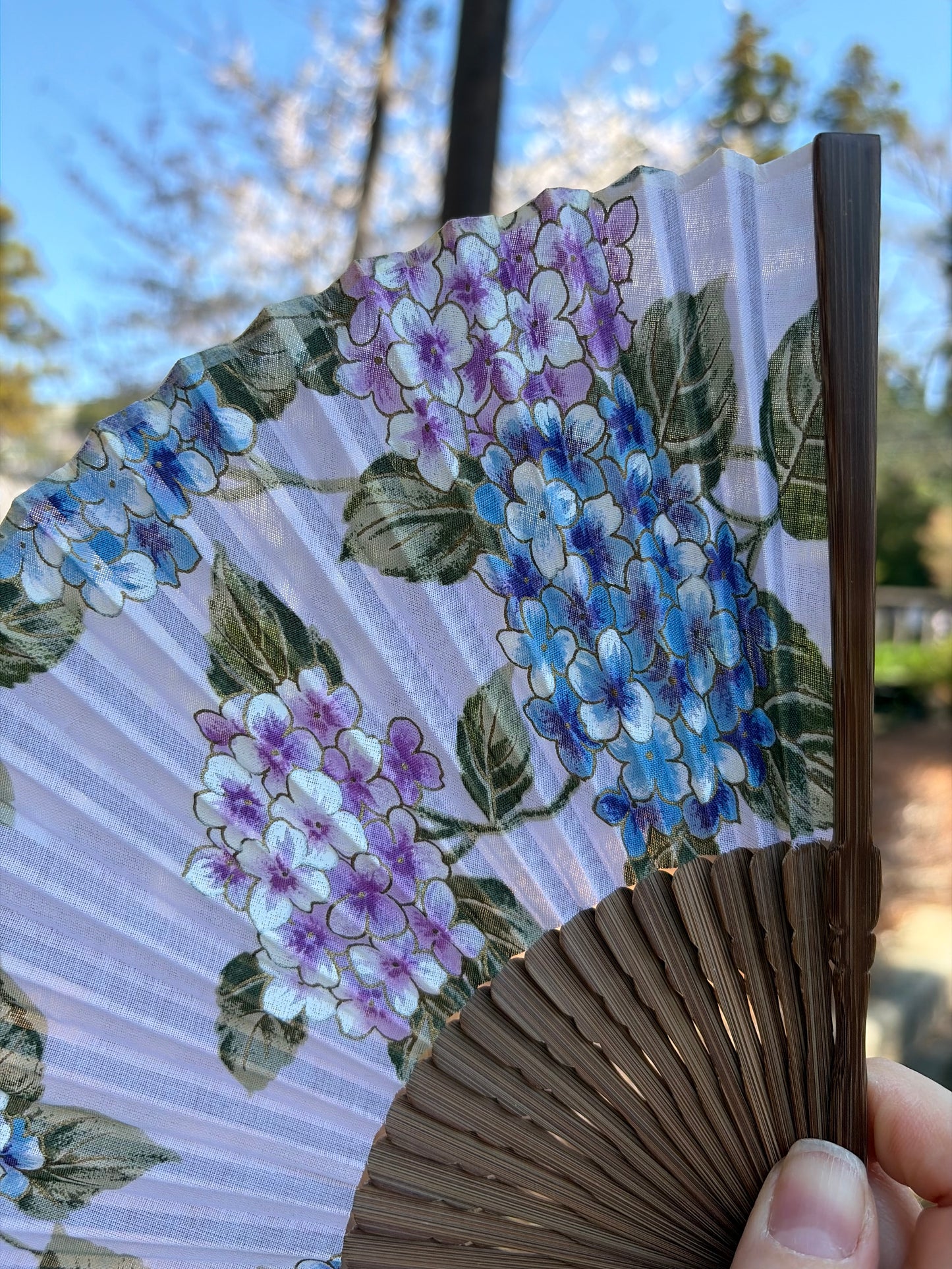 Close-up of the blue and purple hydrangea pattern on the fan