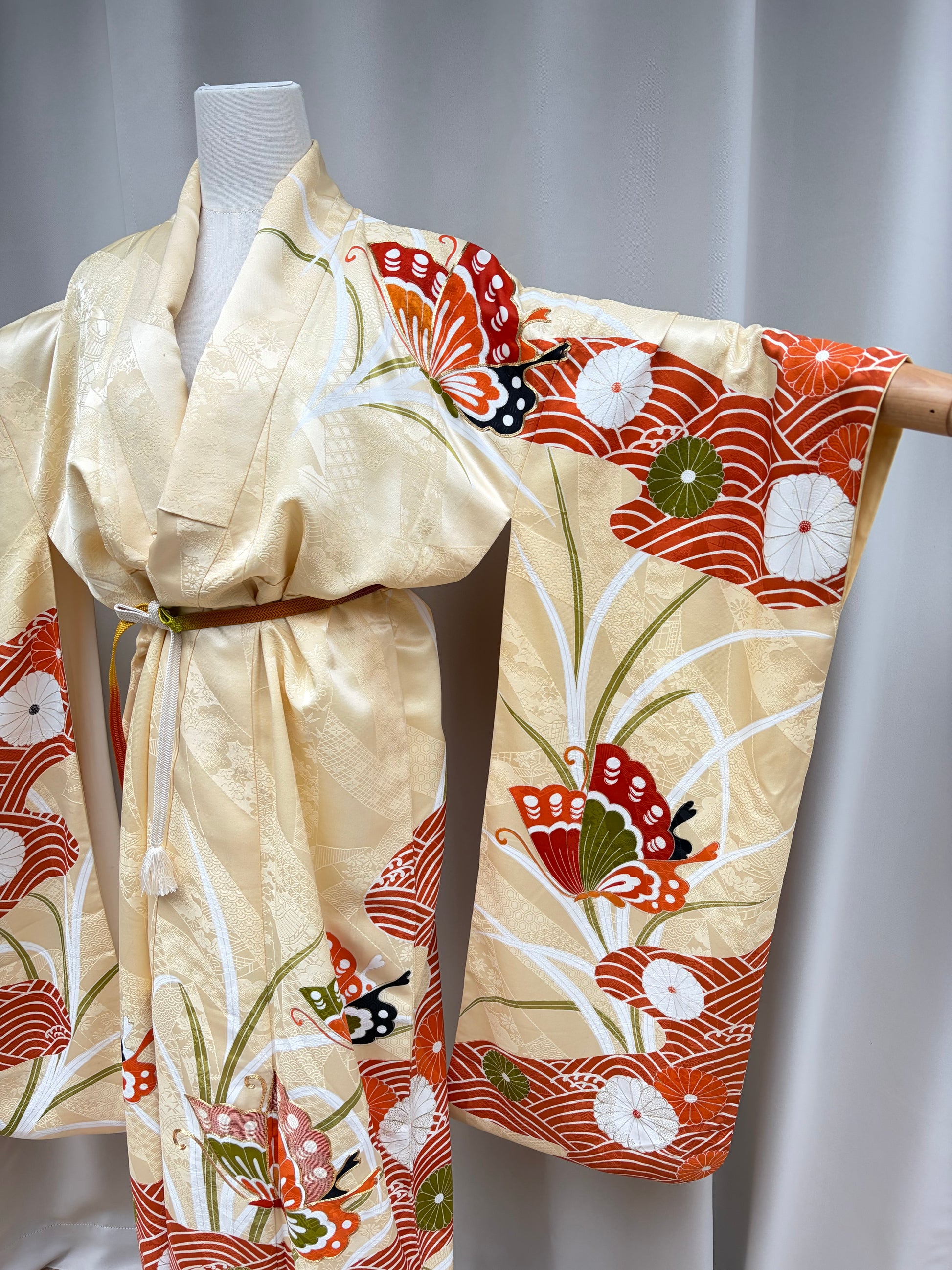 Close-up of the orange and red butterfly motif