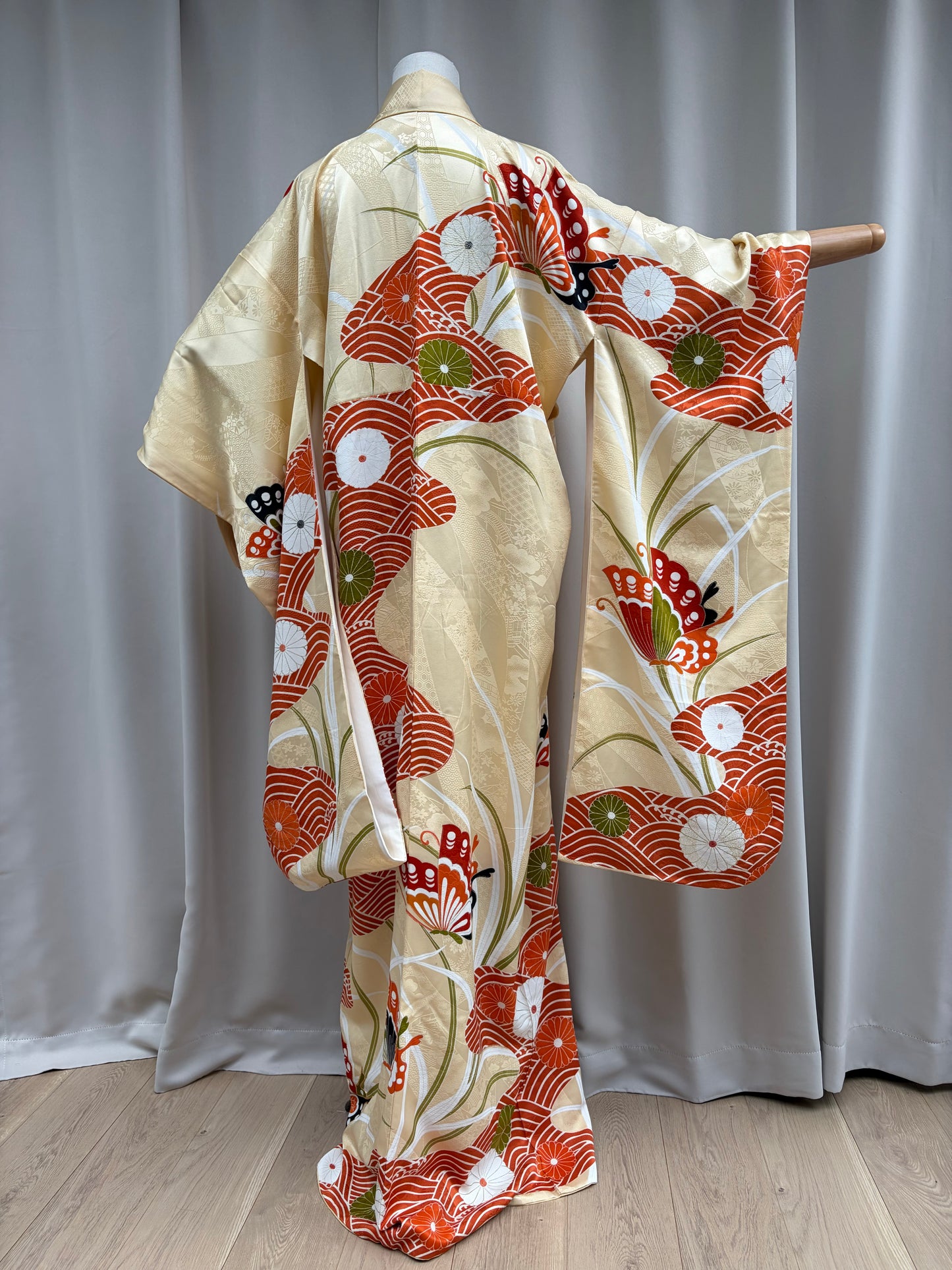 Close-up of the orange and red butterfly motif